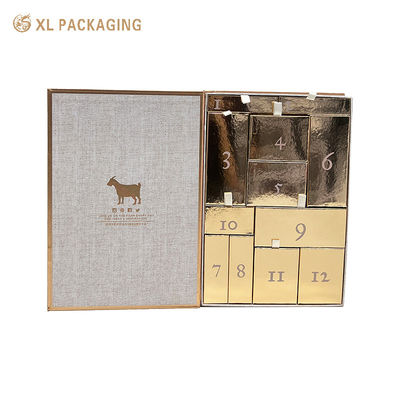 Großhandel Buchförmige Countdown-Kalender Geschenkbox, Magnetische Flipbox mit 12 Goldschubladen, Bandziehtab für Hautpflege-Kosmetik