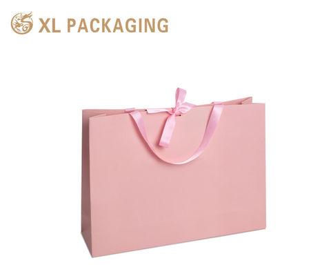 Luxuriöse rosa Geschenktüte mit individuellem Logo, hochwertigem, mattem Karton und Goldfolienprägung für Boutique-Verpackungen
